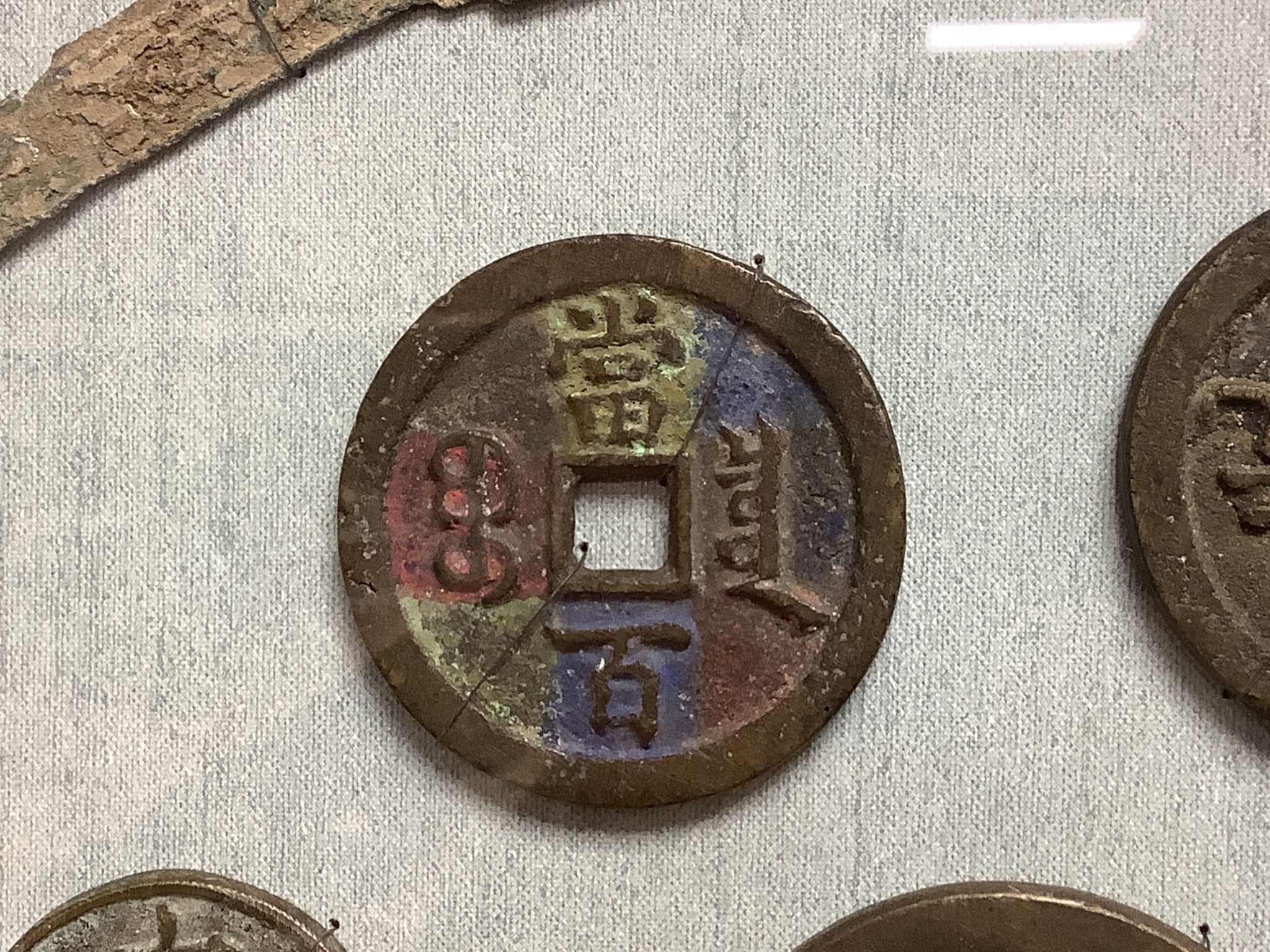 A quantity of framed Chinese coins